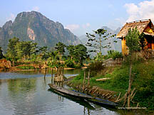 Hut and canoes, Vang Vieng, Laos